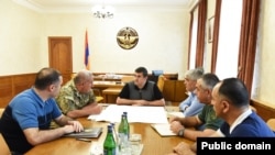Karabakh President Arayik Harutiunian (center) held what appeared to be an emergency meeting with Defense Army commander Kamo Vartanian and other security officials.