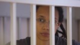 U.S. basketball player Brittney Griner sits inside a defendants' cage as she is given a nine-year prison sentence in Moscow on August 4.