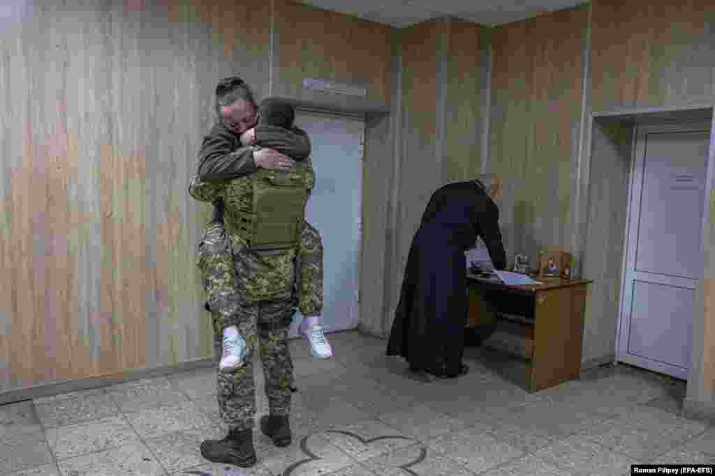 Newlywed soldiers embrace after exchanging vows in the Brovary region, near Kyiv, during the Russian encirclement of the Ukrainian capital. The pair, who asked not to be named, first met in eastern Ukraine in 2015 while fighting against Russia-backed separatists. They started a relationship after reuniting by chance amid the 2022 Russian invasion. &nbsp;