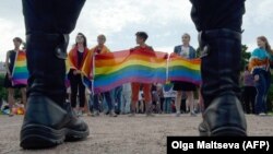 People wave rainbow flags during a gay-pride rally in St. Petersburg in 2017.