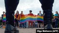 People wave rainbow flags during a gay-pride rally in St. Petersburg in 2017.