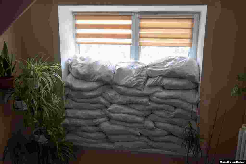 The windows of the hospital are packed with sandbags, and the birthing rooms must adhere to a &quot;two-wall&quot; rule, which says the safest parts of a building are separated from the outside by at least two walls. &quot;Sometimes we&#39;ve had to deliver babies during shelling,&quot; said Tsyhanok.