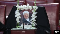 An empty seat, with a photo bearing a portrait of former president Akbar Hashemi Rafsanjani, is seen during a session of Iran's Assembly of Experts in Tehran, March 7, 2017