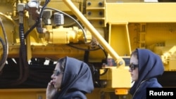 Women attending the 15th International Oil, Gas, Refining & Petrochemical Exhibition in 2010