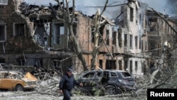 Rescuers work at the site of a Russian strike in Dnipro on May 26.