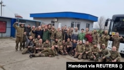 Ukrainian prisoners of war pose for a picture after a recent swap with Russia.