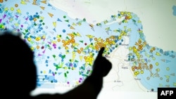 A screen displaying vessel movements in the Strait of Hormuz, a vital conduit of global trade that has been largely paralyzed for nearly six months now.