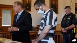 Hadi Matar, 24 (center), listens to his public defense attorney, Nathaniel Barone (left), address the judge while being arraigned in the Chautauqua County Courthouse in Mayville, New York, on August 13.