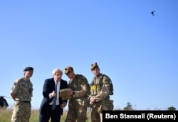 British Prime Minister Boris Johnson flies a Black Hornet nano drone in Salisbury in September 2019.