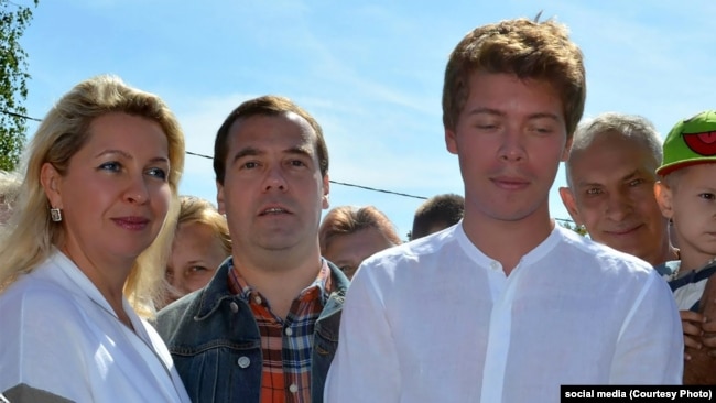 Ilya Medvedev (right) with his father, Dmitry, and mother, Svetlana, in 2013.