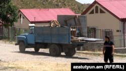 A loaded truck leaves Aghavno on August 10.