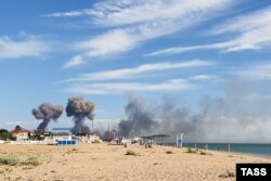 Smoke rises after blasts destroyed a number of Russian aircraft at the Saky Air Base near the village of Novofedorovka on August 9.