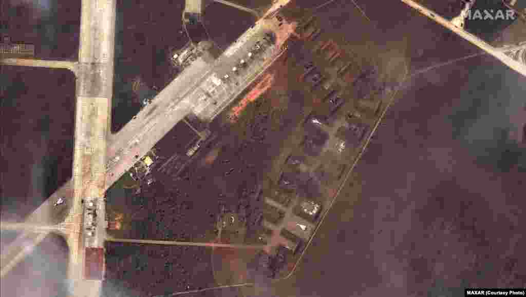 The same view by Maxar shows damaged Russian aircraft at Saky on August 10.