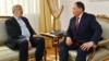 Kazakh Deputy Minister Yermukhambet Konuspaev (right) meets with Ukrainian Ambassador Petr Vrublevskiy. (file photo) 