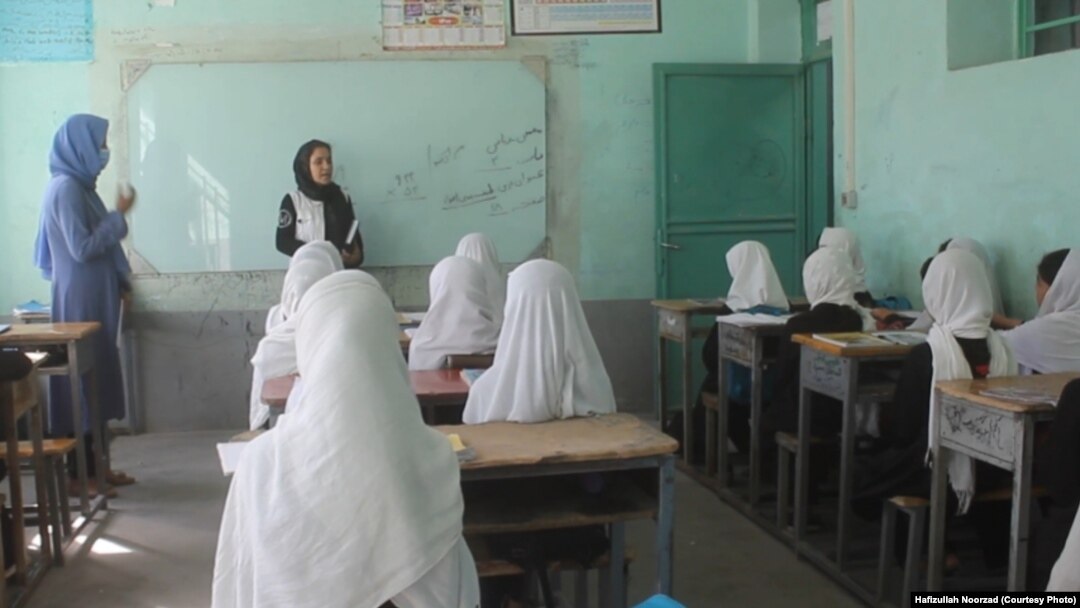 A teacher and students at a class in Farah Province (file photo)