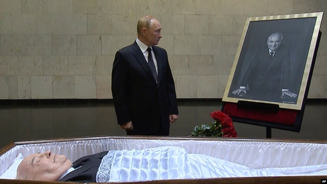Russian President Vladimir Putin pays his last respects near the coffin of former Soviet leader Mikhail Gorbachev at the Central Clinical Hospital in Moscow on September 1.