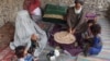 An Afghan family eats bread with tea for breakfast in Kandahar Province. (file photo)