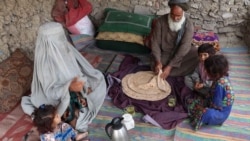 An Afghan family eats bread with tea for breakfast in Kandahar Province. (file photo)
