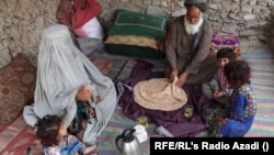 An Afghan family eats bread with tea for breakfast in Kandahar Province. (file photo)