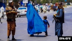 Taliban security officers patrol the streets of Kabul one year after the militant group seized power in Afghanistan. 