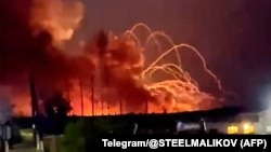 Fire and smoke billows from a munitions depot near the village of Timonovo outside Belgorod on August 18.