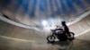 Spectators watch from above as Zoran Milojkovic rides the Wall of Death in Belgrade. The stunt rider, who is from the northwestern Bosnian town of Banja Luka, is believed to be the last of his kind on the Balkan peninsula.