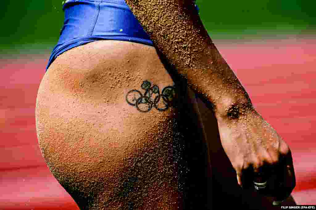 Ukraine&#39;s Maryna Bekh-Romanchuk is covered in sand during the women&#39;s triple jump qualification during the 2022 European Championships in Munich.