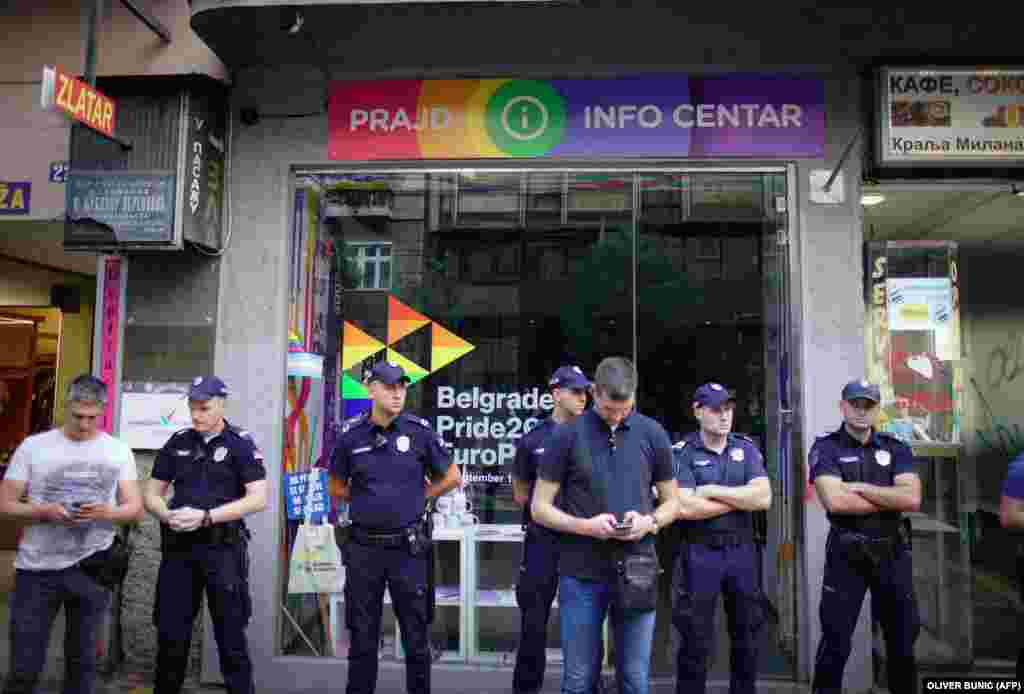 Police secure an LGBT info center during the protest march in Belgrade on August 28. Since 1992, a different European city has hosted the EuroPride event.