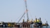 A planned floating liquefied natural gas terminal is shown under construction off the coast of Germany.