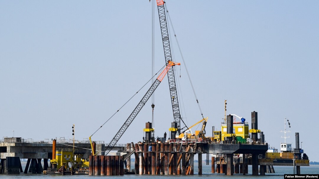 A planned floating liquefied natural gas terminal is shown under construction off the coast of Germany.