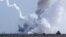 Video and photographs posted on social media showed a series of blasts and explosions in Crimea's Dzhankoy district.