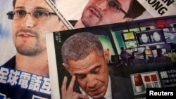 تصاویر ادوارد اسنودن و باراک اوباما در صفحات نخست روزنامه‌های چینی در هنگ کنگ.