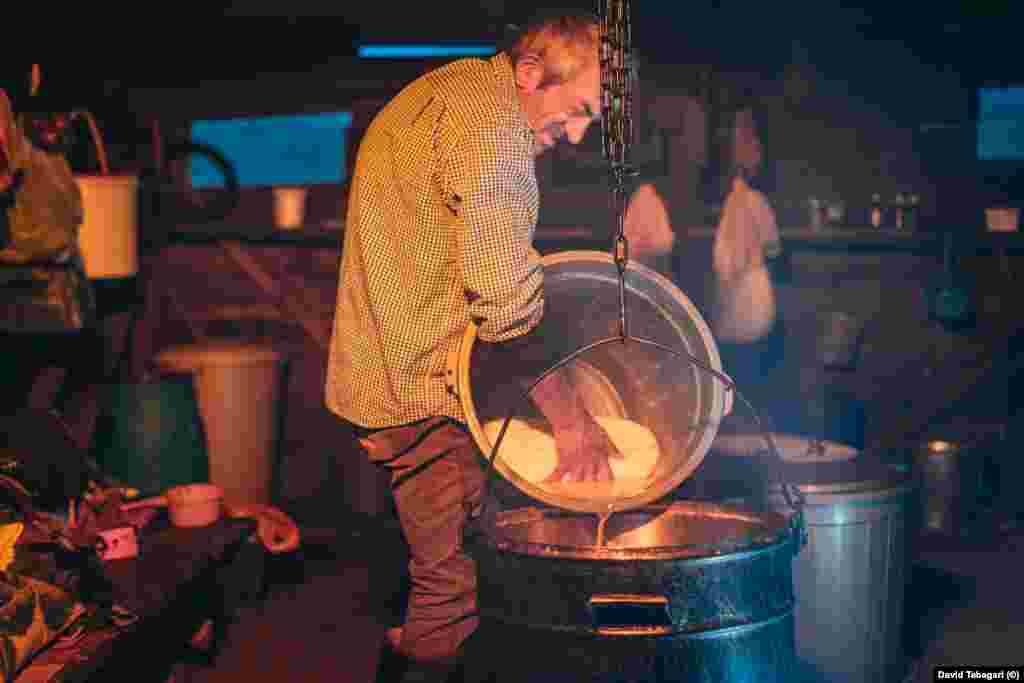 Work continues into the night. The life of a cheese maker is tough, and the men say the money made from selling the cheese at nearby markets isn&rsquo;t enough to attract the younger generations into the mountains.