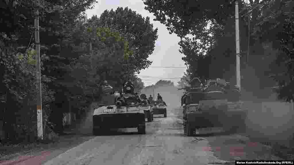 Ukrainian tanks roll down a residential street in the Donbas as they near the front line.&nbsp;