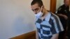 Hadi Matar, the man accused in the attempted murder of British author Salman Rushdie, leaves court in Mayville, New York, on August 18.