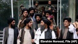 Mullah Abdul Ghani Baradar (center right), acting deputy prime minister of the Afghan Taliban-led government, joins other Taliban officials in Kabul. The Afghan Taliban helped facilitate talks between Islamabad and Tehrik-e Taliban earlier this year.