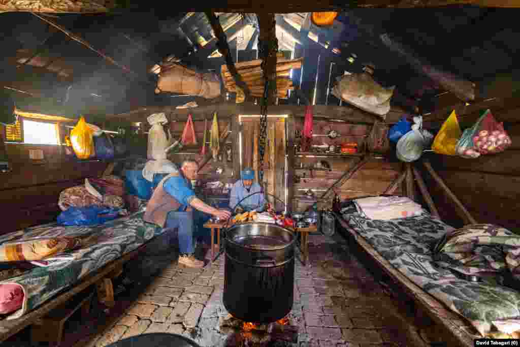 Inside, the huts are basic affairs without electricity or running water. The centerpiece is a firepit used for cheese-making.