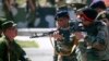 An Indian Army officer aims a Russian assault rifle while visiting a range outside the Russian city of Vladikavkaz. India imports much of its military hardware from Russia. (file photo)