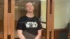 Ivan Safronov attends his trial in the Moscow City Court on August 30, the day after a Russian investigative group concluded the high treason charges against him are "baseless."