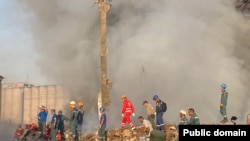 Armenia -- Rescue workers on August 15 continued to search for survivors after the previous day’s major explosion and fire at the Surmalu shopping center in Yerevan. 