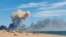 Smoke is seen from the beach at Saky after explosions were heard from the direction of the Russian military air base near Novofedorivka in Crimea in August