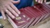 An employee organizes blank Russian passports at a factory in Moscow. (file photo)