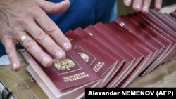 An employee organizes blank Russian passports at a factory in Moscow. (file photo)