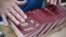 An employee organizes blank Russian passports at a factory in Moscow. (file photo)