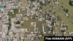 This aerial photograph taken on August 31 shows flooded residential areas after heavy monsoon rains in the Jaffarabad district of Balochistan Province.