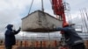 RUSSIA - Workers work atop of one of the skyscrapers of Capital Towers residential complex under construction in Moscow, May 18, 2020. 