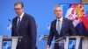 Serbian President Aleksandar Vucic (left) and NATO Secretary-General Jens Stoltenberg arrive for a media conference at NATO headquarters in Brussels on August 17.