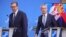 Serbian President Aleksandar Vucic (left) and NATO Secretary-General Jens Stoltenberg arrive for a media conference at NATO headquarters in Brussels on August 17.
