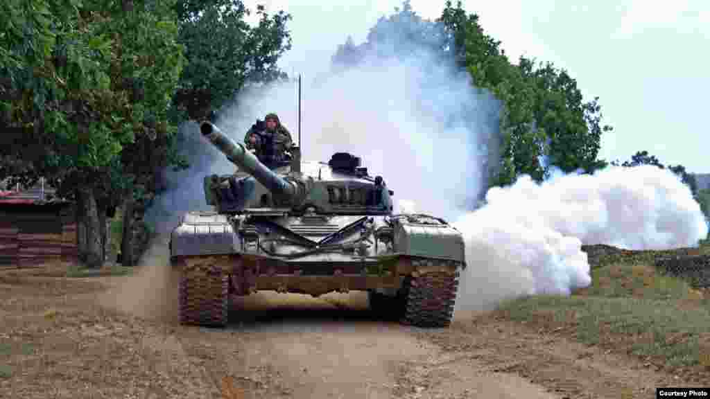 A Serbian tank takes part in drills near Kosovo on August 31. Earlier that day, Serbia&rsquo;s Defense Ministry announced that military drills were being held alongside the border with Kosovo to &quot;ensure peace and security on the administrative line.&quot;