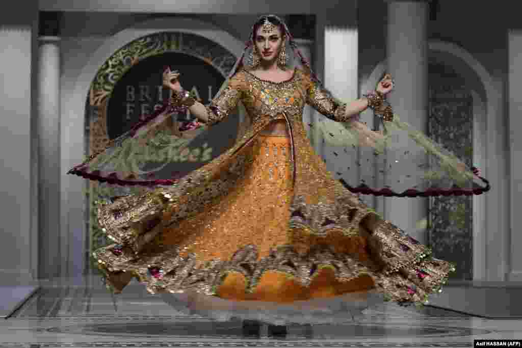 A model presents a creation during the Bridal Festive fashion show in Karachi, Pakistan.
